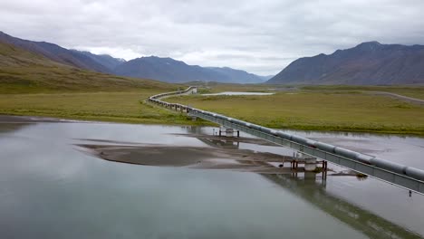 alaska - crude oil pipeline in scenic alaskan countryside, aerial drone