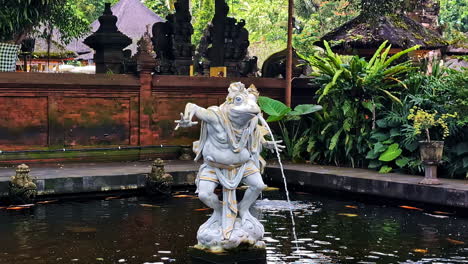 shot of frog shaped fountain at pura tirta empul (hindu temple) in bali, indonesia