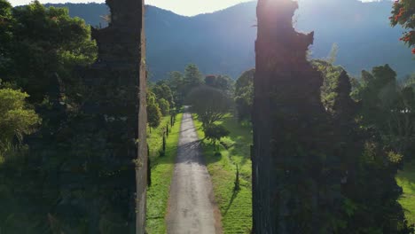 drone shoot passing through the famous handara gate in the countryside of bali, indonesia