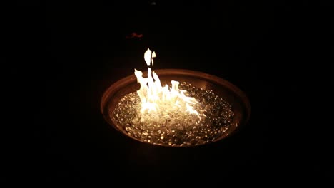 a fire burns at night in 120p super slow motion