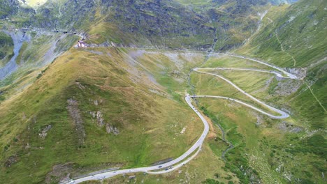 aerial trucking pan of transfagarasan serpentine road overview of extreme landscape