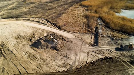 Bulldozers-landscaping-a-large-developmental-construction-site---aerial-view