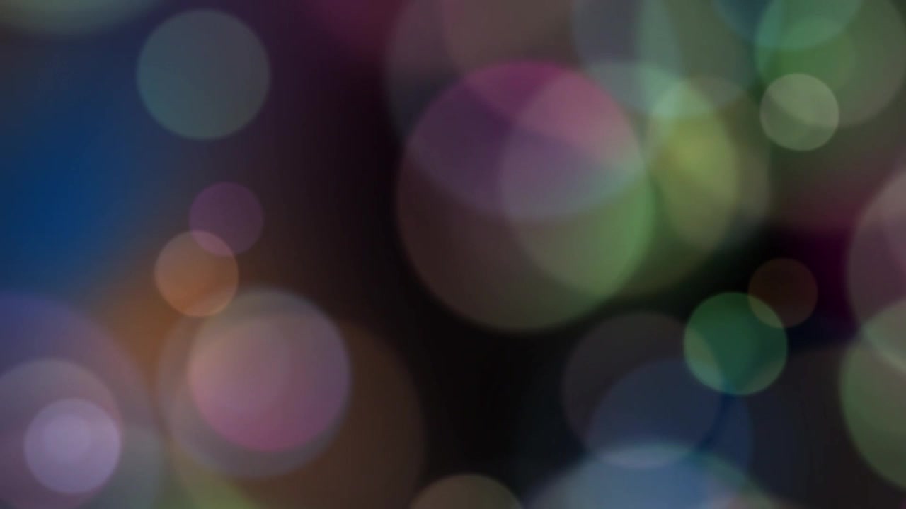 Colorful Bokeh Light Circles Floating on Black Background