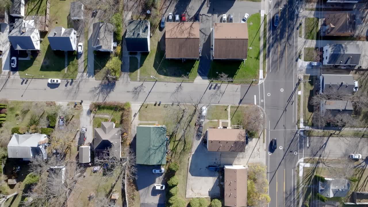 Neighborhood homes in East Lansing, Michigan with drone video overhead.