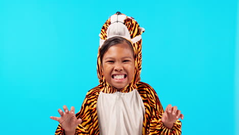 tiger costume, roar and face of girl in studio