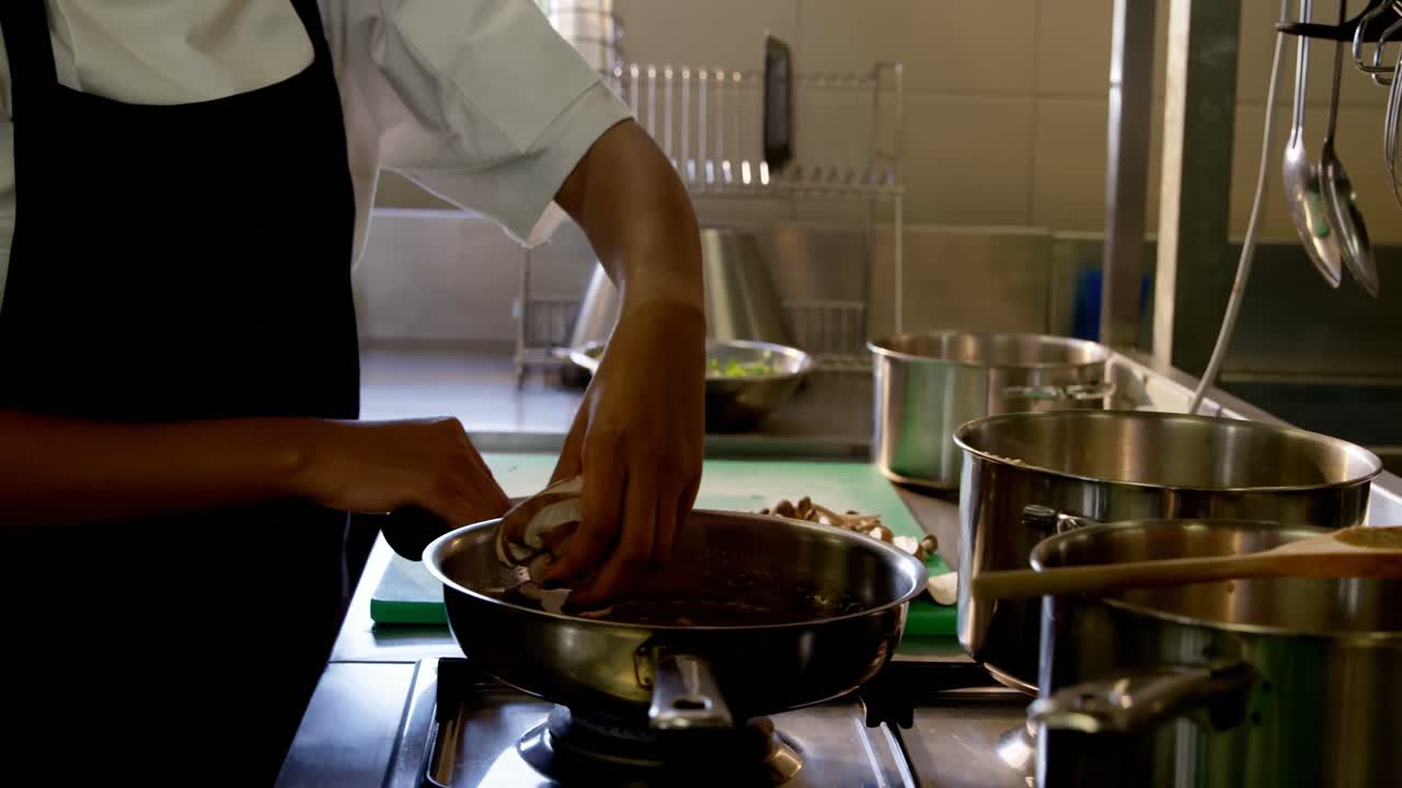 Female chef preparing food in kitchen 4k