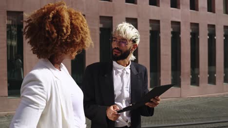 business meeting in front of office building