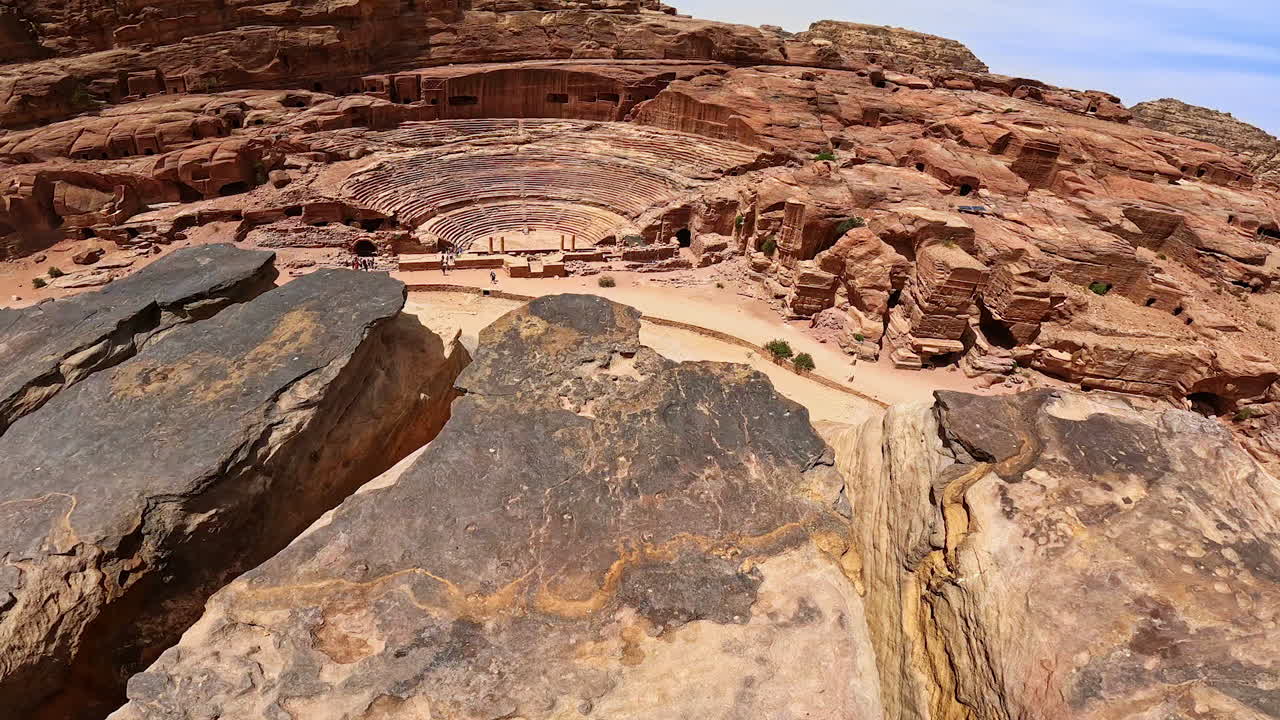 Jaw-dropping scenery of Petra, Jordan, West Asia. View on the ancient structures and little souvenir shop from top of the high rock.