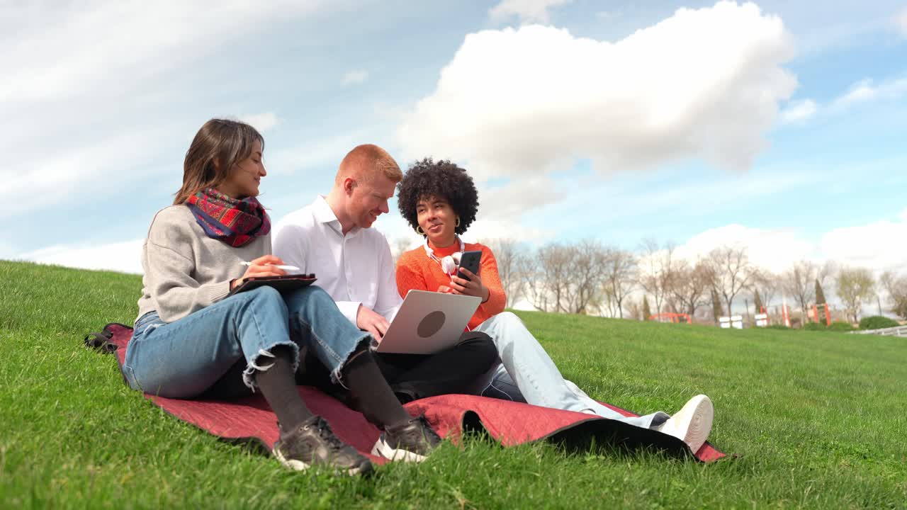 Group of students studying outdoors