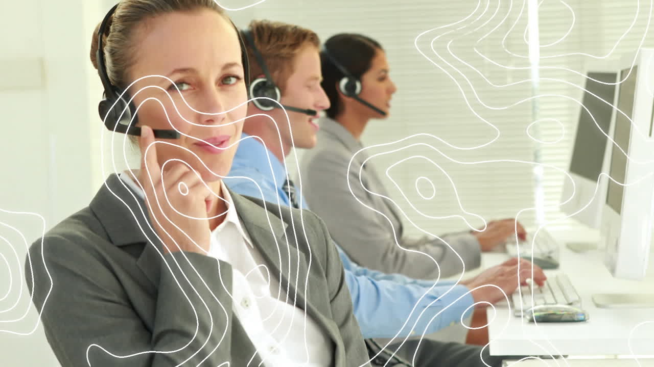 Animation of moving lines over business people wearing phone headsets
