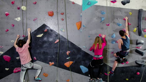 Teenage-boys-and-girl-climbing-indoors