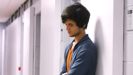 worried student waiting in the hallways