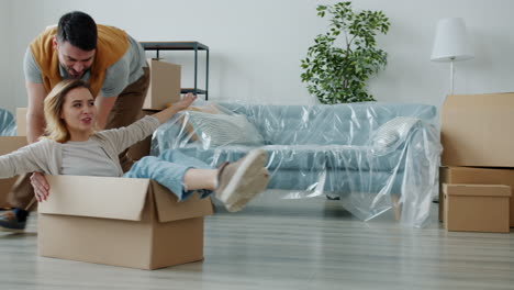 fun couple moving into a new home