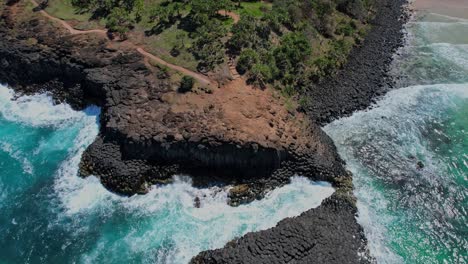 people trekking on the trail of fingal head in northern rivers region, nsw, australia