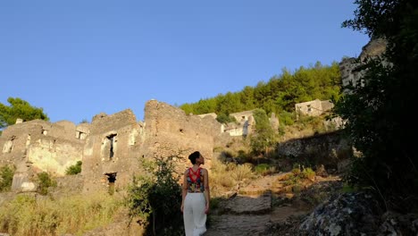 woman-walks-among-historical-buildings