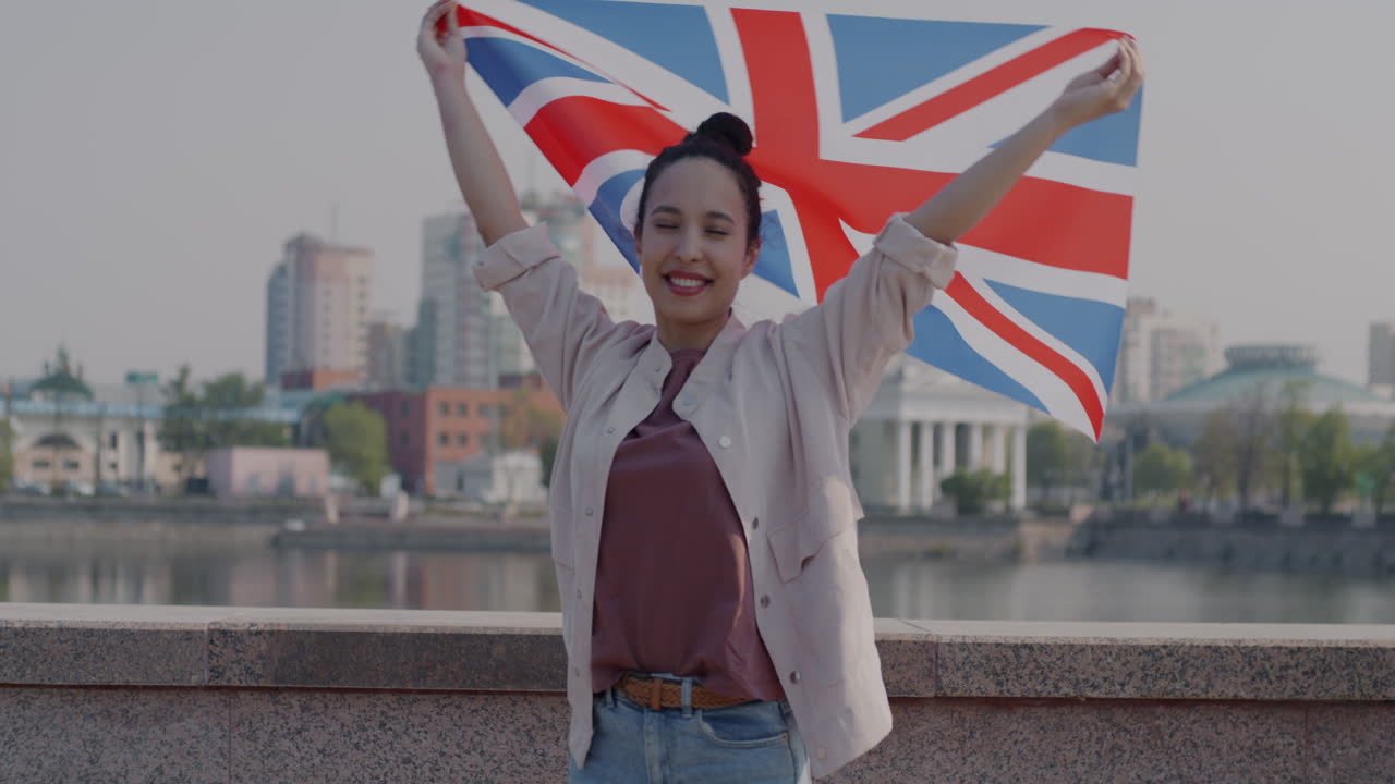 Woman Holding British Flag Outdoors