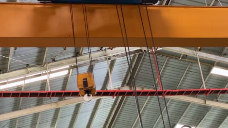 hook of overhead crane swaying. running overhead crane.