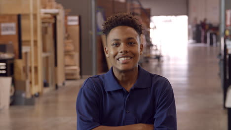 Male-Factory-Worker-Walks-Towards-Camera-In-Slow-Motion