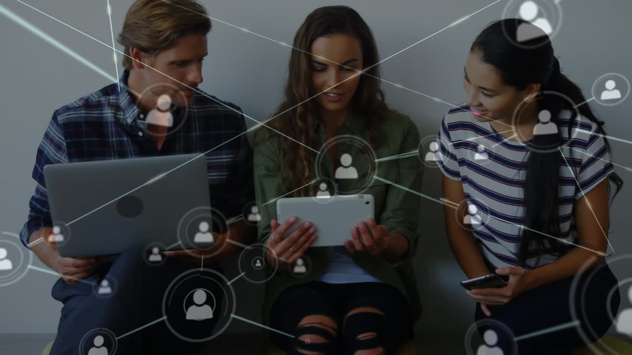 Network of connection icons against office colleagues using electronic devices