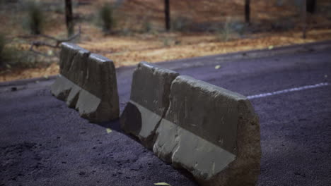 road barriers positioned along a deserted path in the countryside at dusk