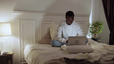 young tired man on bed