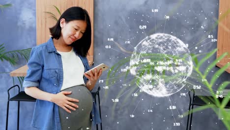 animation of globe with data processing over asian pregnant woman using smartphone
