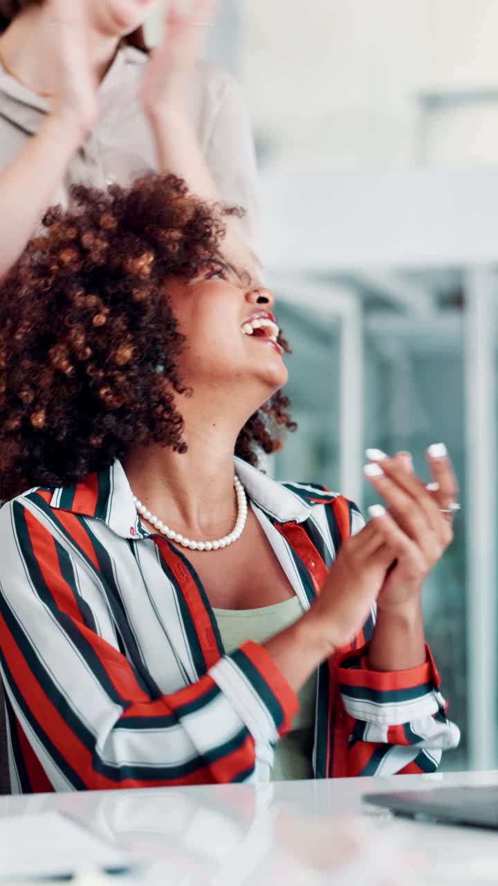 Young African American Woman Clapping and Laughing in Office
