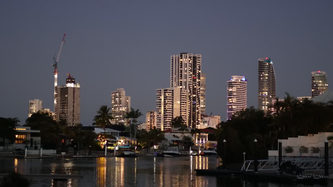 Time-lapse of a cityscape transitioning from day to night