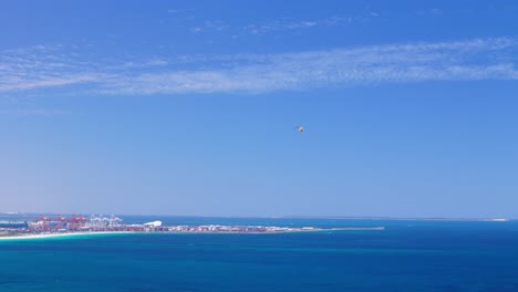 drone watching helicopter flying in the distance over fremantle port in western australia