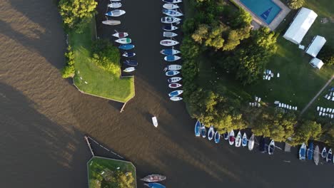 a small sailing boat leaving yachting club náutico san isidro in buenos aires