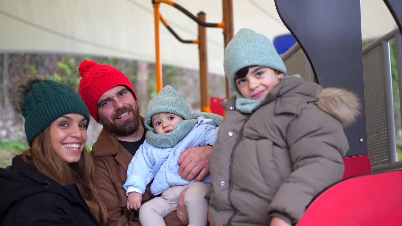 Family Enjoying a Winter Day at the Playground