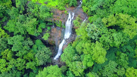 waterfall-in-greenery-forest-drone-view