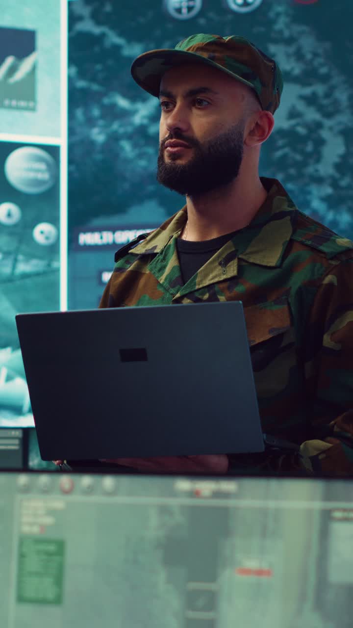 Military Man in Camouflage Uniform Working on Laptop in Control Room