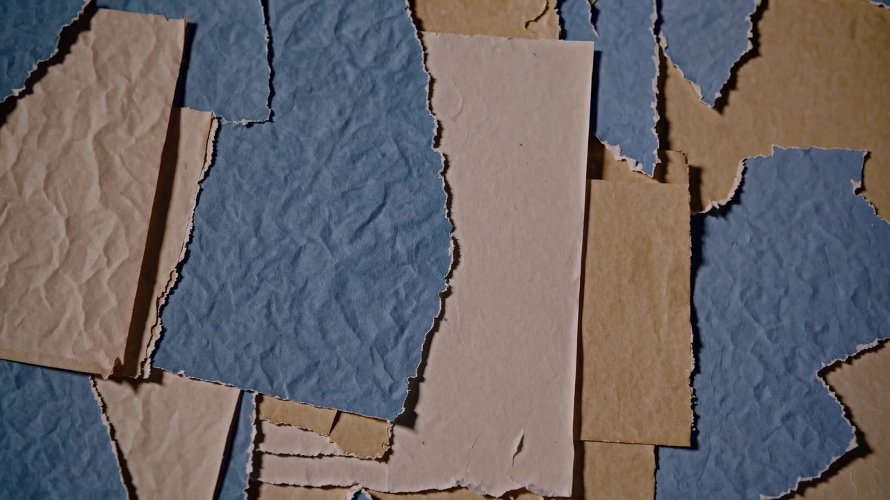 Textured Background with Overlapping Torn Blue and Beige Paper
