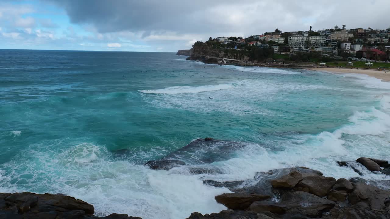 Powerful ocean waves crash onto Bronte Beach, creating a breathtaking display of coastal energy, natural beauty, and the rugged charm of the Australian shoreline.