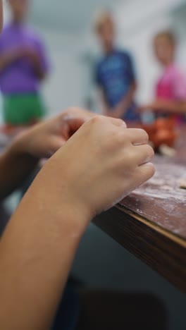 children sculpting with clay