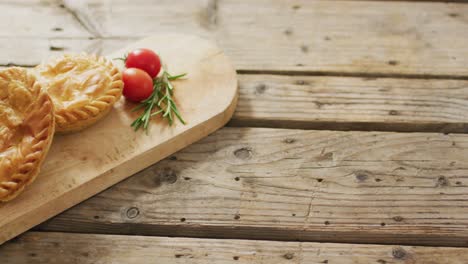 Video-of-pies-seen-from-above-on-wooden-background