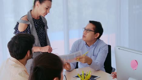 unhappy business people in group meeting after project failure.