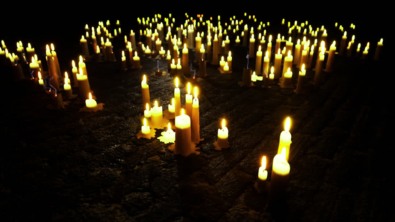 Candles illuminate a dark area creating a peaceful and reflective atmosphere