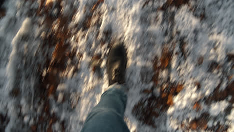 male walking fast pov winter snow leaves