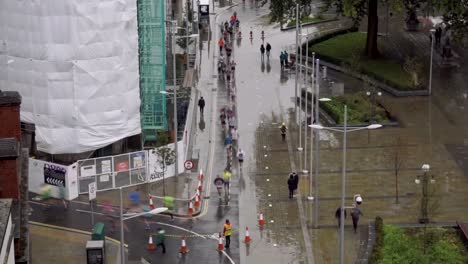 sped up timelapse aerial view of runners in bristol city centre