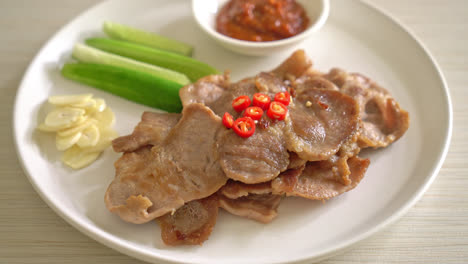 grilled pork neck sliced on plate in asian style