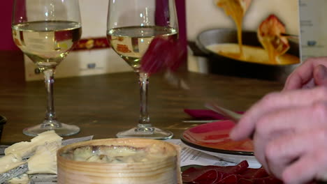 cheese fondue with wine and charcuterie