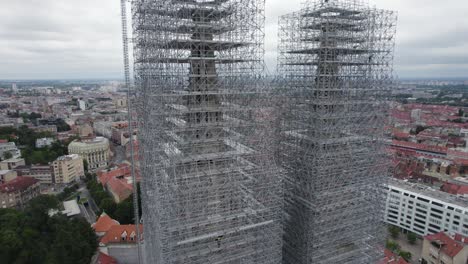 cathedral of zagreb: towers under renovation, enveloped in scaffolding - aerial orbit