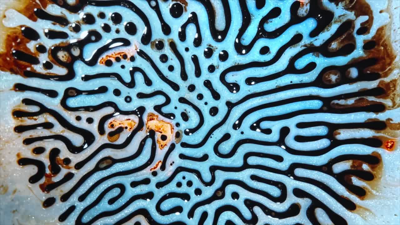 Mesmerizing Black Liquid Forming Organic Patterns on Blue Background