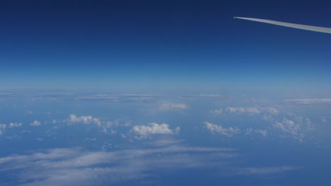 Aerial-view-from-a-cockpit,-plane-flying-over-the-ocean-timelapse