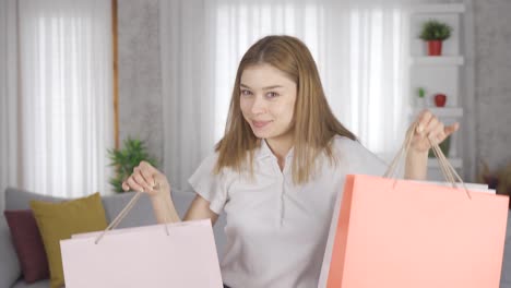 young girl loves shopping. shopping bags are colorful.