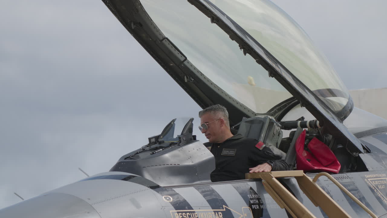 Pilot in Fighter Jet Cockpit Preparing for Flight