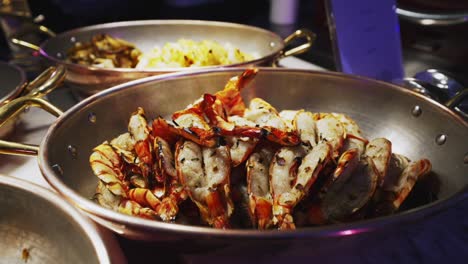 grilled-butterfly-prawns,-served-hot-from-the-pan-at-a-festive-party