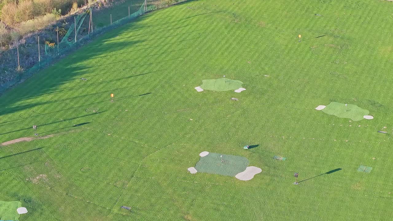 Aerial view of Waterfront Golf Club driving range fairway with various target flags, Rotherham, UK